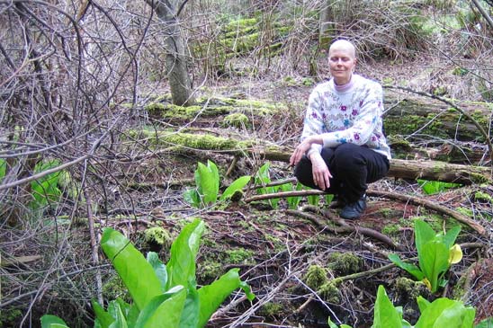 Rosemarie, now bald, spring 2006 on a nature hike, skunk cabbage just starting to emerge from the wetland