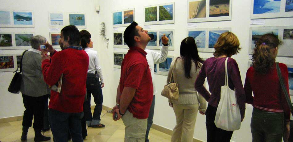 Many people enjoying an exhibition of the Keoughs photography in Budapest Hungary